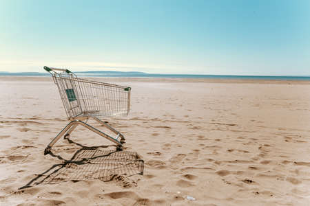 trolley from the supermarket on the beachの写真素材