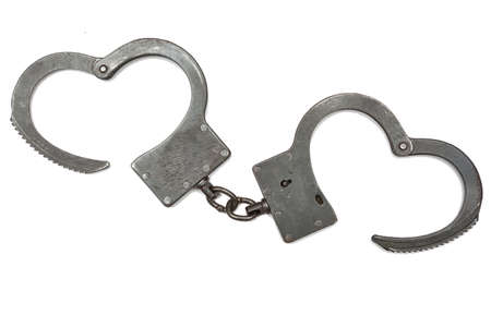 Handcuffs on a white background. Concept of crime and punishmentの写真素材