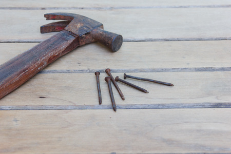 hammer and nails on wooden boardの写真素材