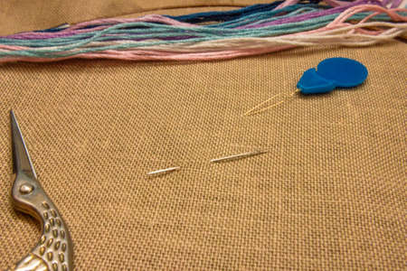 embroidery, brown uniform canvas and floss threadsの写真素材