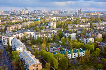 The aerial View of urban residential district in Kyiv, Ukraine in spring evening.View over the city...