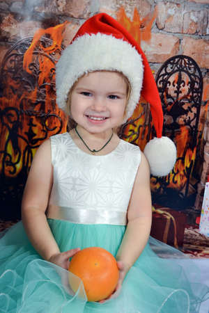 Cute little girl in Santa Claus hatの写真素材