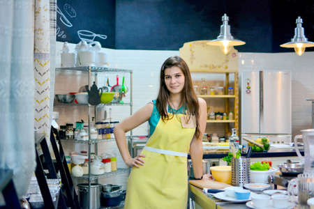 Young woman cook in the kitchenの写真素材