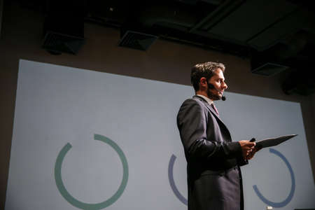 Public speaker giving talk at Business Event