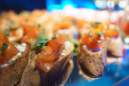 Sandwich with red fish. salmon canape on buffet tableの写真素材