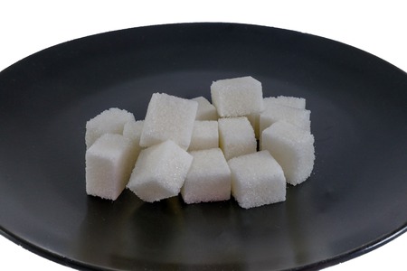 Images of refined sugar on black plateの写真素材