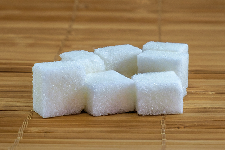Images of refined sugar on bamboo backgroundの写真素材
