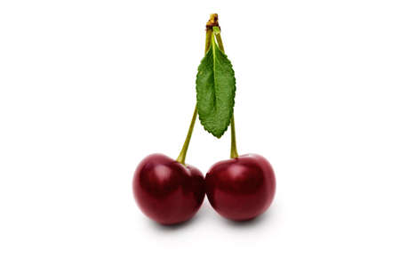 Cherry with leaves isolated on white background.