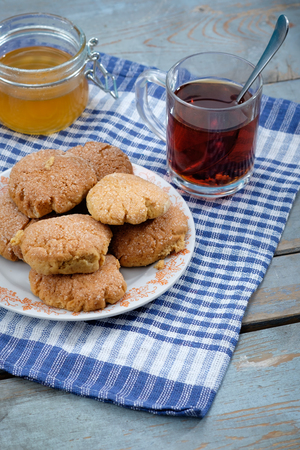tea, honey and honey cookies on wooden table. Rustic conceptの写真素材