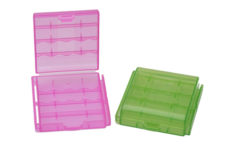 Two plastic battery pink and green holder isolated on white backgroundの写真素材
