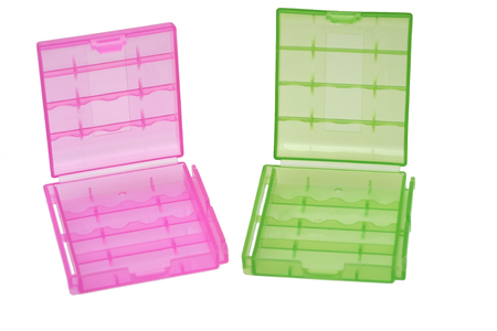 Two plastic battery pink and green holder isolated on white backgroundの写真素材
