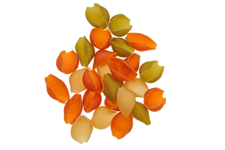 Raw colored shell pasta isolated on white backgroundの写真素材