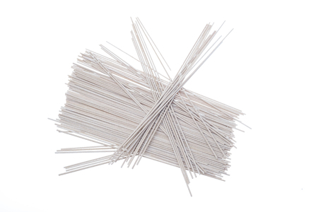 Raw buckwheat noodles isolated on white background. Close upの写真素材