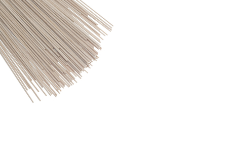 Raw buckwheat noodles isolated on white background. Close upの写真素材