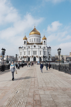 Moscow, Russia - 18 March 2017: Cathedral of Christ the Saviour. Cathedral of Christ the Saviour is a cathedral in Moscow, People walking at the bridge near the Cathedral of Christ the Saviour in Moscowのeditorial素材