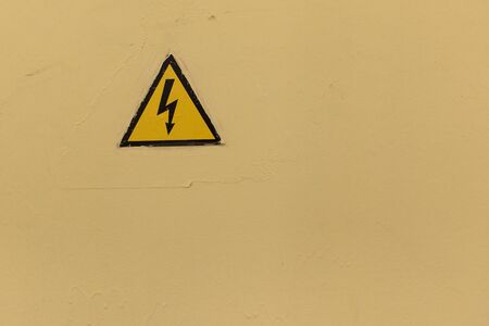 High Voltage Sign on old metall backgroundの写真素材