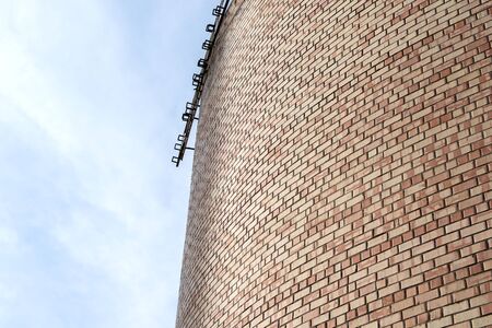 Part of bricks wall on sky backgroundの写真素材