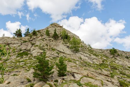 Beautiful mountain landscape, rocks and blue sky with clouds. Summer timeの写真素材