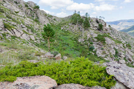 Beautiful mountain landscape, rocks and blue sky with clouds. Summer timeの写真素材