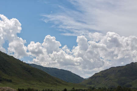 Beautiful clouds over the mountains. Cloud over the mountain range.の写真素材