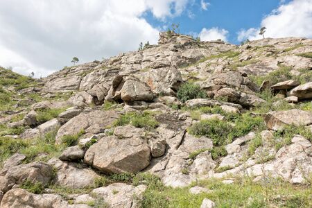 Beautiful mountain landscape, rocks and blue sky with clouds. Summer timeの写真素材