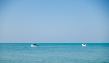 two boats in the beautiful tropical oceanの写真素材