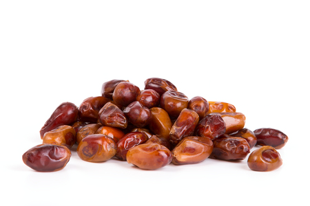 The fruits of date palm on a white backgroundの写真素材