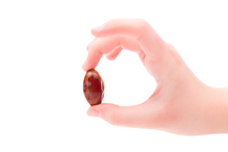 The fruit of the date palm in the hands of man