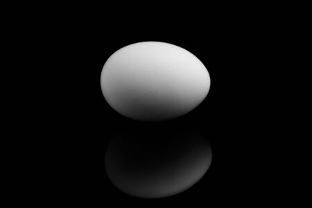 Egg white on a black backgroundの写真素材