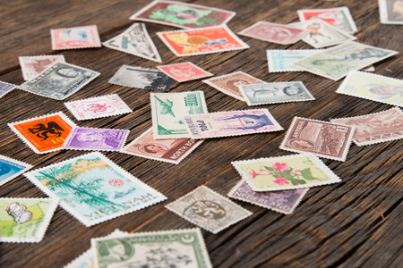 Collection of postage stamps. Postage stamps on the table. Philatelismの写真素材