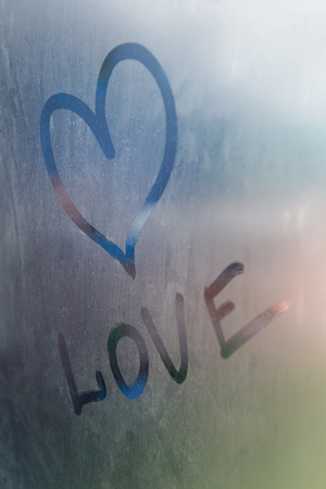 The Word of Love in a Foggy Windowの写真素材