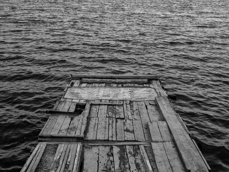 Old lonely mooring on the lakeの写真素材