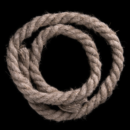 Thick rope on a black background. Sea ropeの写真素材
