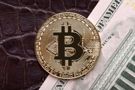 Bitcoin and dollar closeup.の写真素材