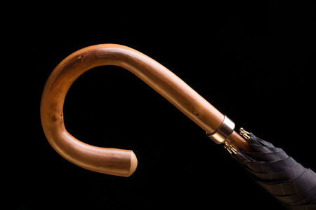 The handle of the umbrella canes on a black background.の写真素材