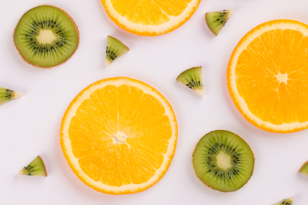 Fruit background. Fruits sliced on a light background.の写真素材