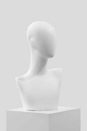 Mannequin on a white catwalk. Fashionable mannequin without eyes and mouth.の写真素材