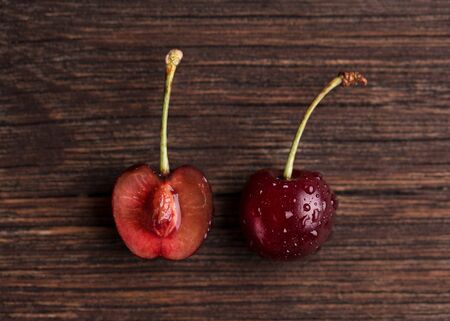 Ripe cherry on a wooden background.
