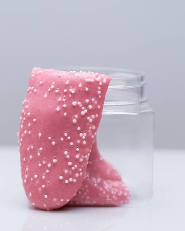 Pink slime flowing out of the can.
