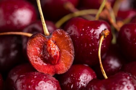 Sliced cherry closeup. A lot of cherries.の写真素材
