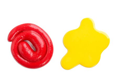 Toy slime. Red and yellow mucus of different shapes on a white background.の写真素材