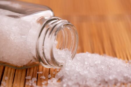 Salt sprinkled on the kitchen table.