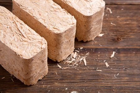 Pressed sawdust fuel briquettes. Briquettes for the oven close-up.の写真素材