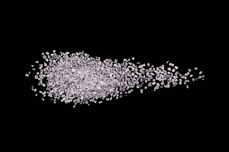 A scattering of crystals of white salt.