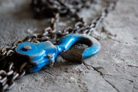 Metal hook and chain close up. Large hook and metal chain.の写真素材