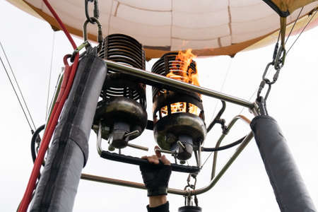 hot air balloons. Hot air balloon or aerostat, bright burning fire flame from gas burner equipment. Cose up from inside.の写真素材