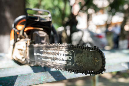 Chainsaw close-up. Selective focus on the saw chain.の写真素材