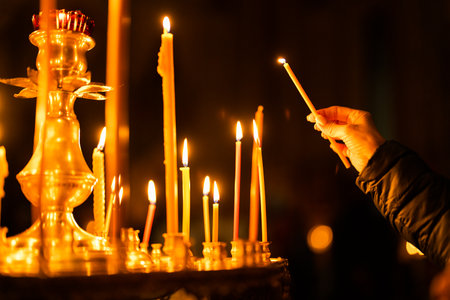 Candles in a Christian Orthodox church background. Burning candles during church service.