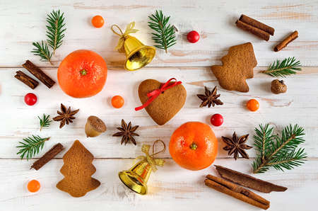 Christmas background with tangerines, cookies, xmas tree branches and spicesの写真素材