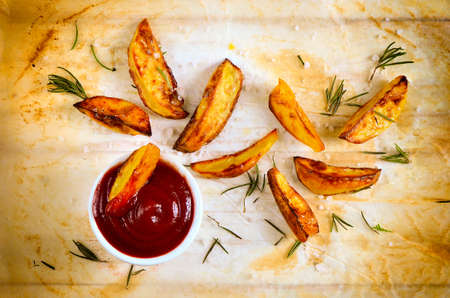 Tomato sauce and roasted potatoes  seasoned with sea salt and rosemaryの写真素材